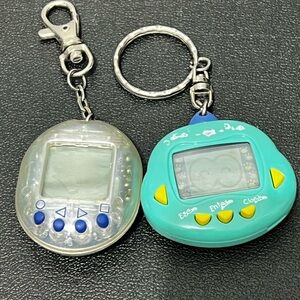 Tamagotchi digital pets set of two not tested keychains Vintage 90s